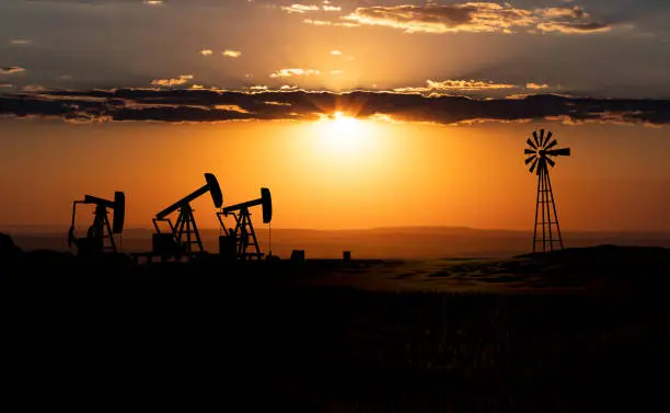 Oilfield equipment at sunset